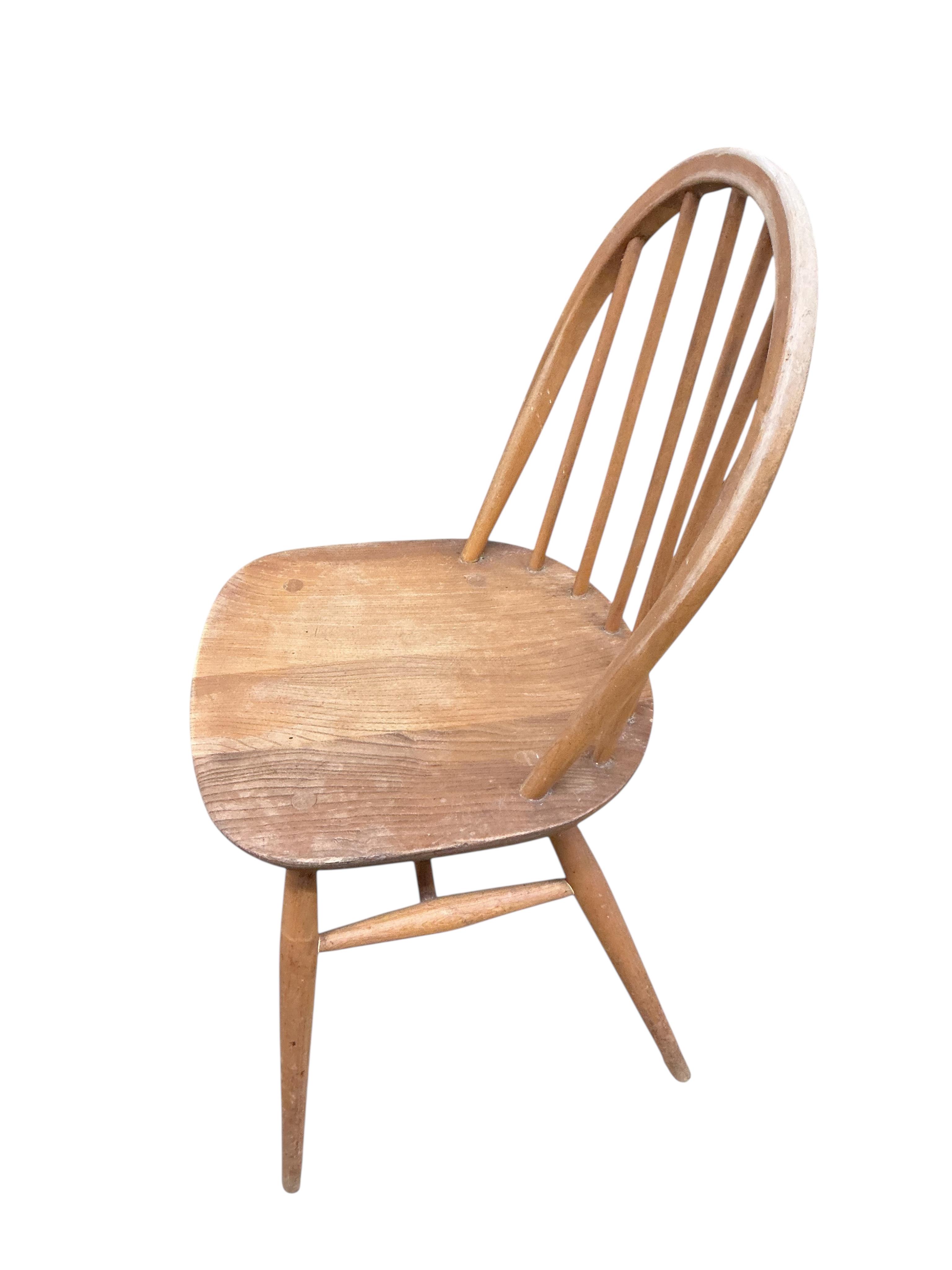 A set of six mid century Ercol elm and beech comb back chairs